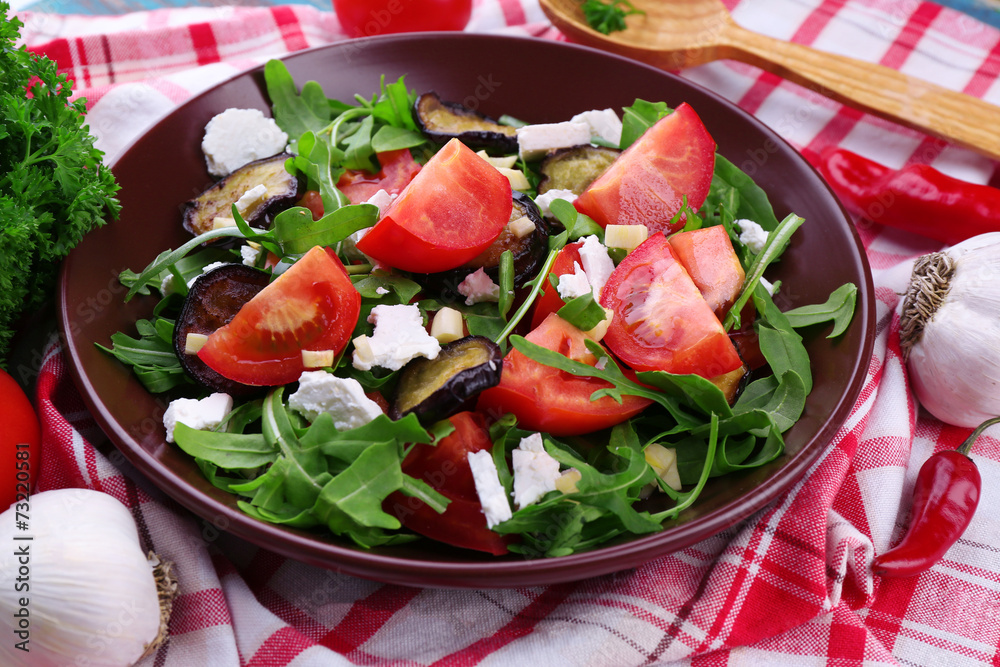 Eggplant salad with tomatoes, arugula and feta cheese,