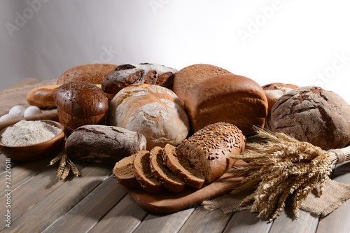 Fresh bread on table on white background
