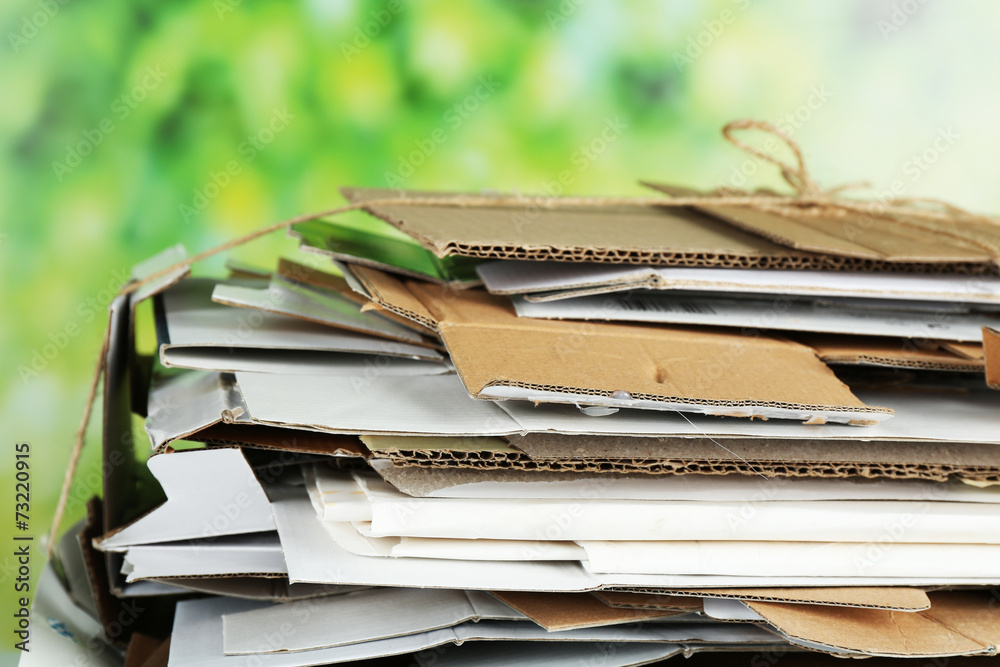 Big stack of papers on green background, close-up Big stack of papers on green background, close-up