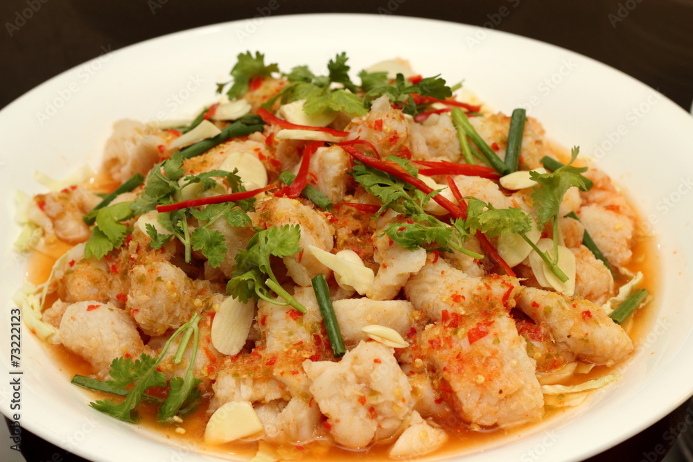 Spicy salad with shrimp, fish and vegetables on white dish. Spicy salad with shrimp, fish and vegetables on white dish.