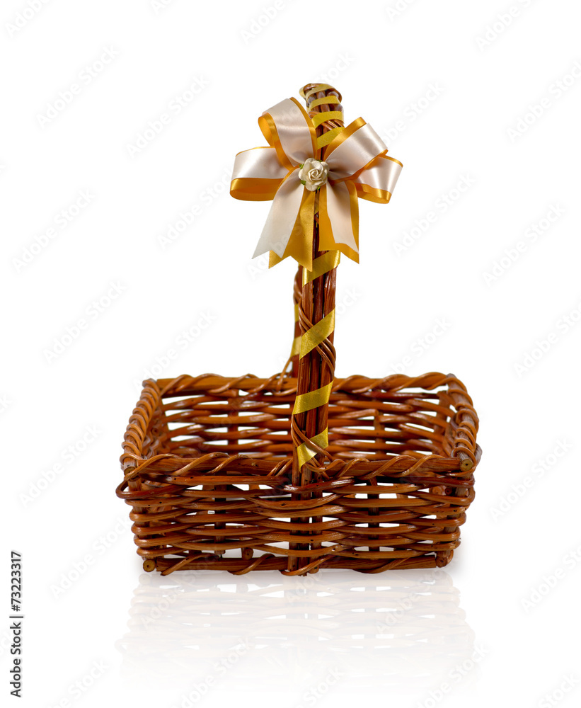 Empty wicker basket with bow isolated on white background