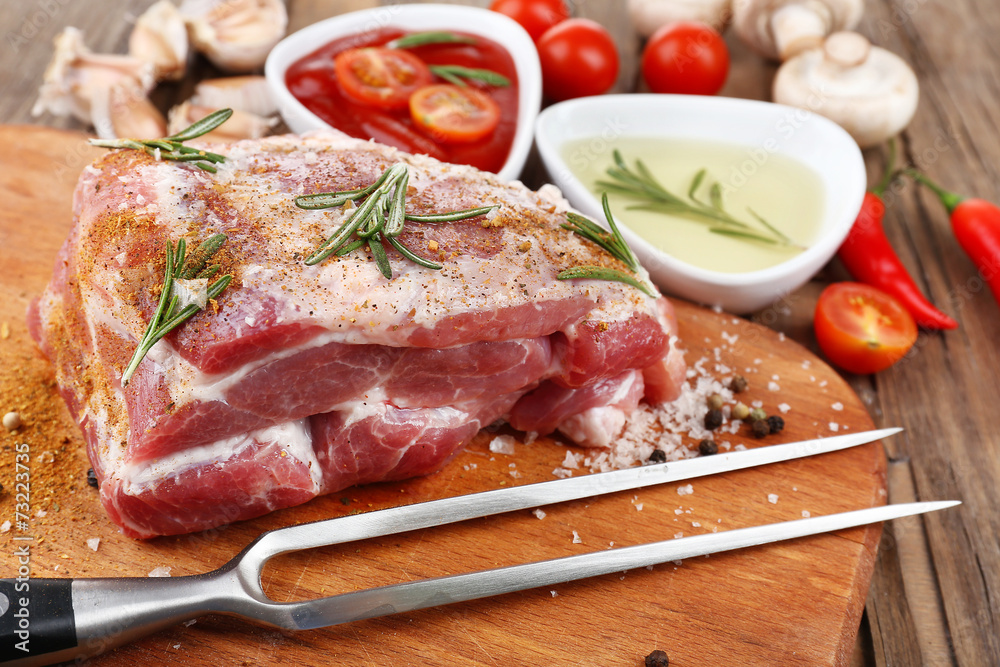 Raw meat on wooden table, close-up