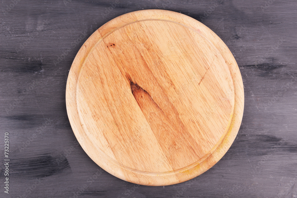 Empty cutting board on wooden background Empty cutting board on wooden background