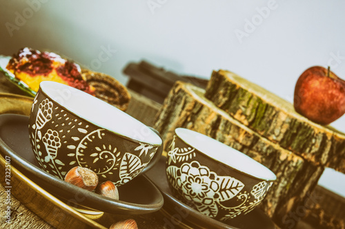 Tea cups on old vintage wooden table