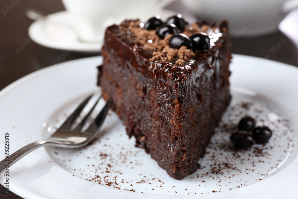 Yummy chocolate cake served on table, close-up Yummy chocolate cake served on table, close-up