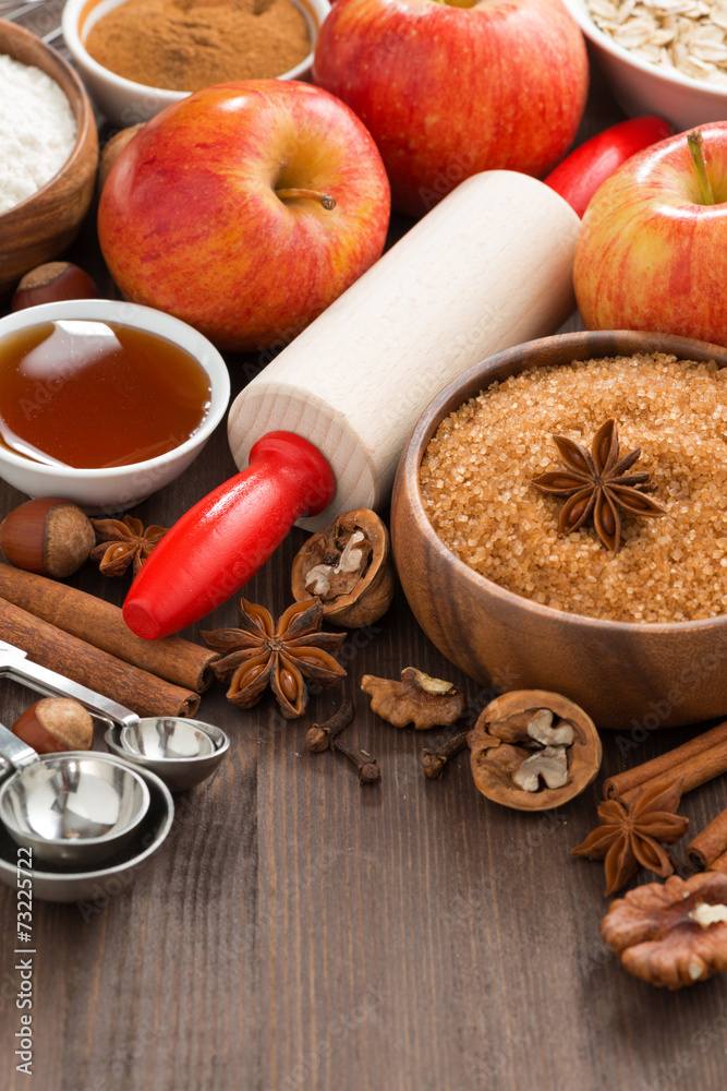 ingredients for baking apple pie and wooden background, top view