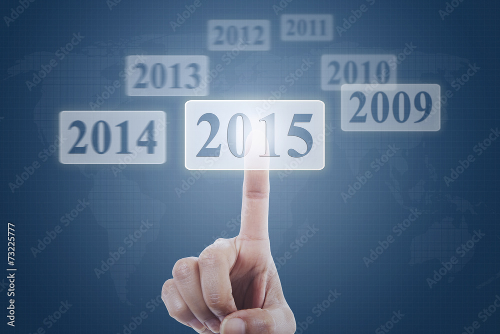 Hand clicking number 2015 on virtual screen Hand clicking number 2015 on virtual screen