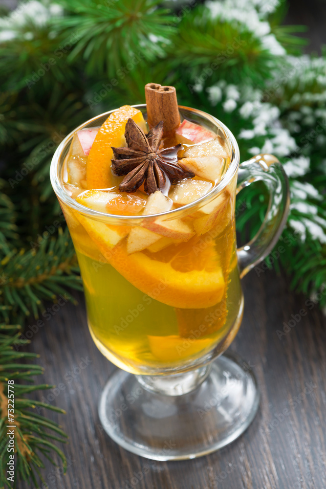 spiced apple cider in a glass on a wooden background spiced apple cider in a glass on a wooden background