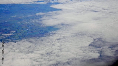 View of clouds from a plane's window photo