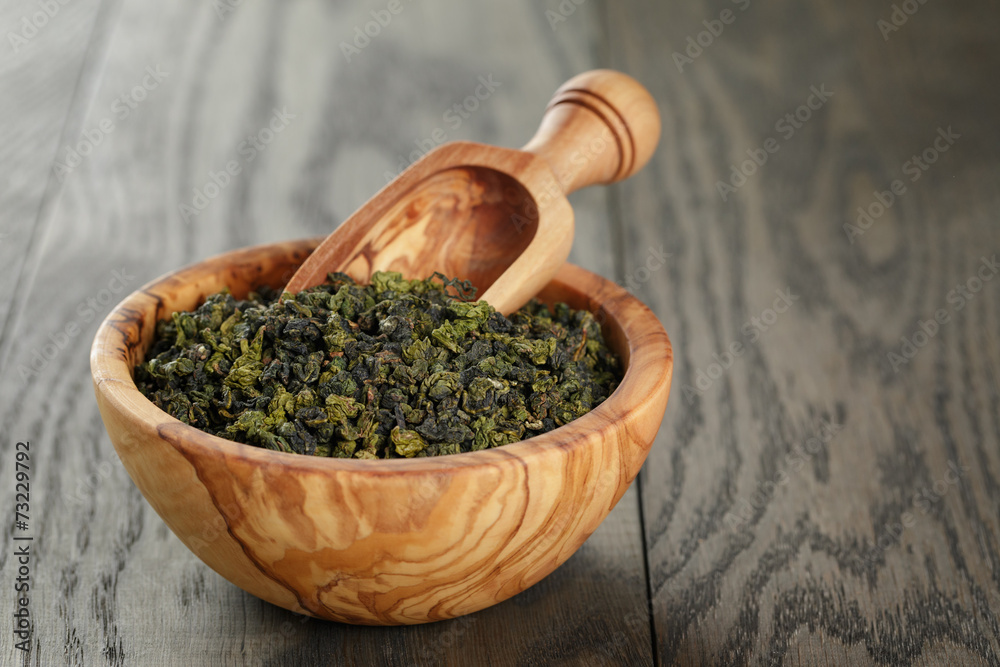 oolong green tea in olive bowl oolong green tea in olive bowl