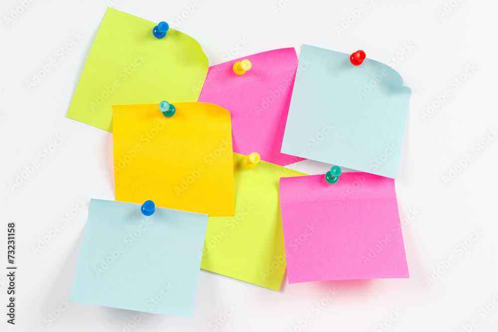 Colorful stickers on a white message board Colorful stickers on a white message board