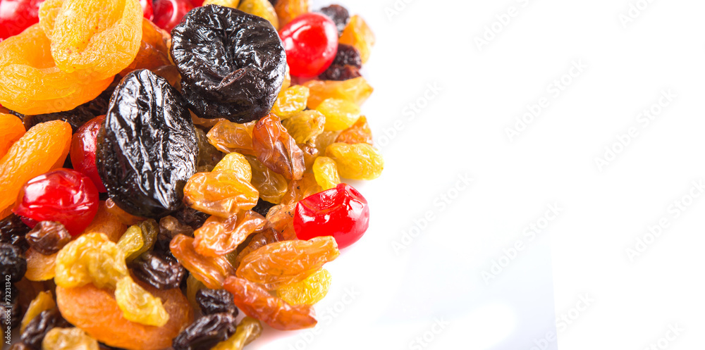 Mix variety of dried fruit over white background Mix variety of dried fruit over white background