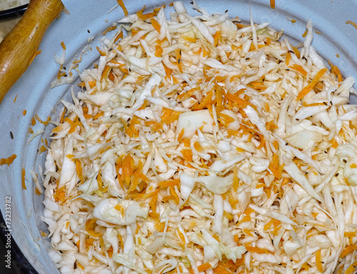 The sredded sauerkraut in enamel bucket photo