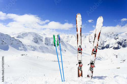 Skiing , mountains and ski equipments on ski run