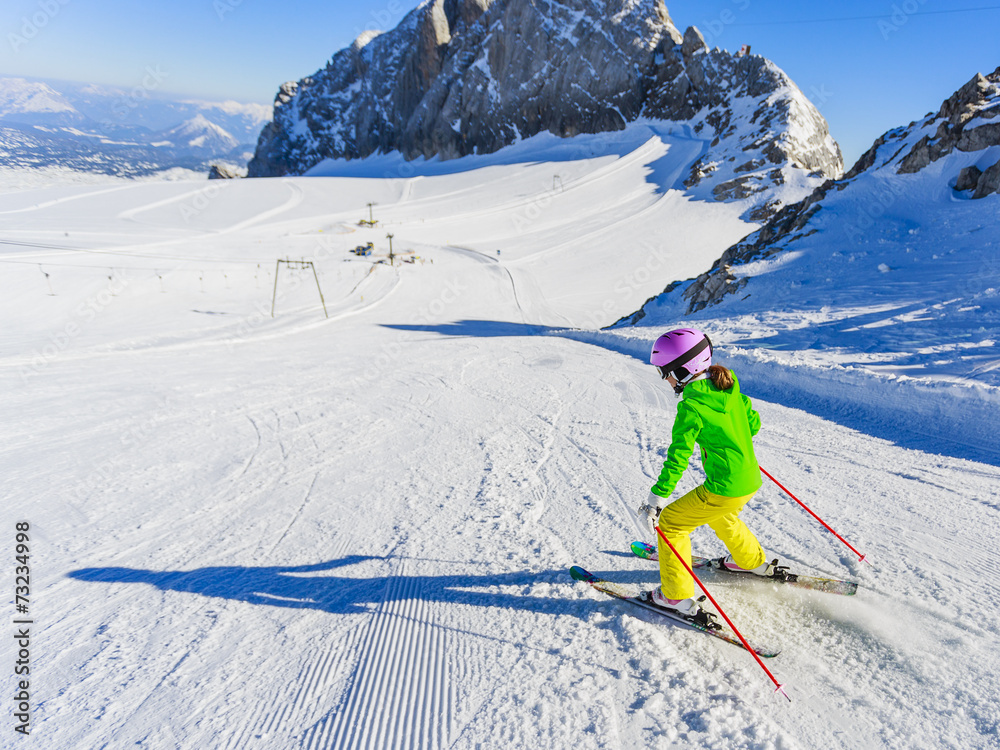 Skiing, winter, ski lesson - little skier on mountainside