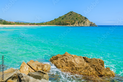 Fototapeta Naklejka Na Ścianę i Meble -  Rocks in turquoise sea on coast of Sardinia island at Costa Rei