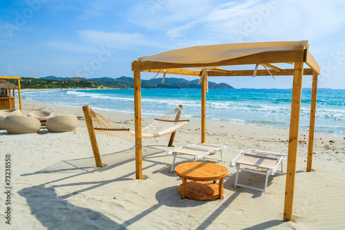 Sunchairs and hammocks on Porto Giunco beach, Sardinia island © pkazmierczak