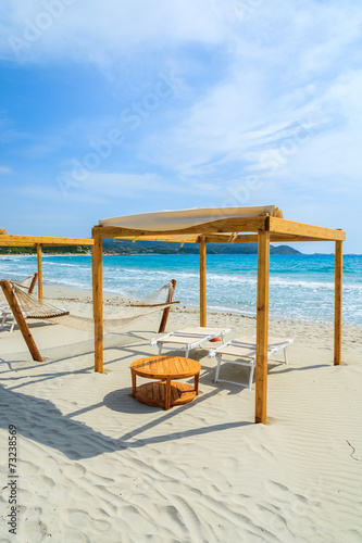 Sunchairs and hammocks on Porto Giunco beach, Sardinia island