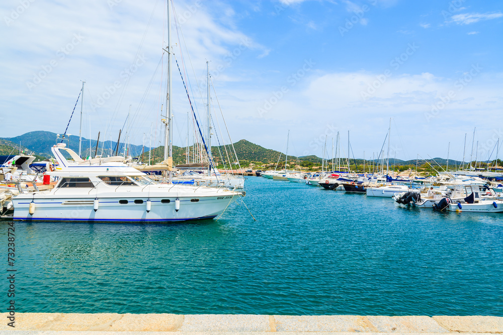 Obraz premium View of Porto Giunco port with sailboats and yachts, Sardinia