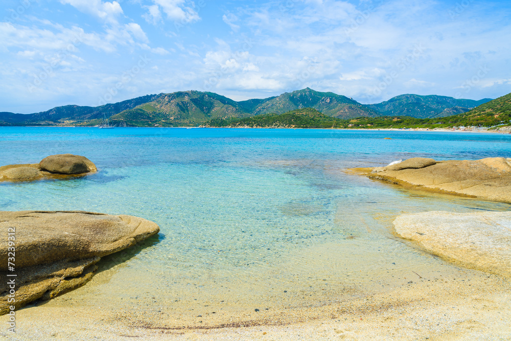 Rocks and sea water on Campolungo beach, Sardinia island, Italy Rocks and sea water on Campolungo beach, Sardinia island, Italy