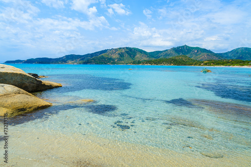 Rocks and sea water on Campolungo beach, Sardinia island, Italy © pkazmierczak