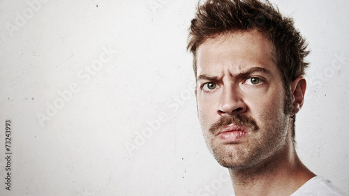 Portrait of an angry man with mustache photo