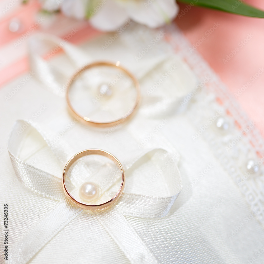 Wedding gold rings bride and groom on decorative pillow. Wedding gold rings bride and groom on decorative pillow.