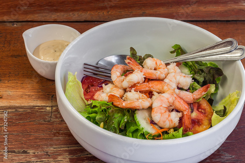 Dressing salad with boiled shrimp