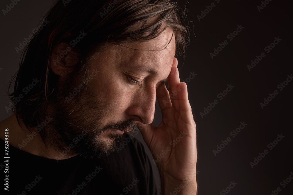 Bearded adult man with migraine headache Bearded adult man with migraine headache