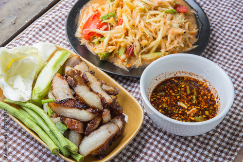 Closeup Thai papaya, charcoal-boiled pork neck,Grill pork (popular food Thailand)