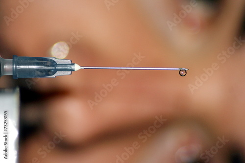 Syringe with needle and patient