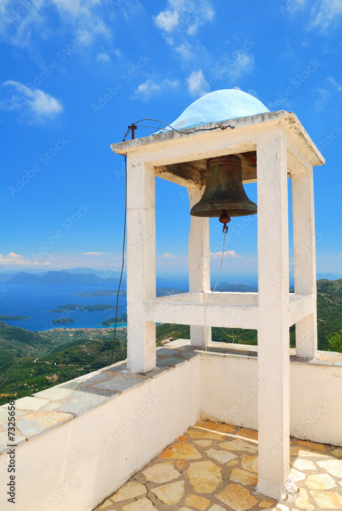 Small belfry with an old bell watching over the island of Lefkad