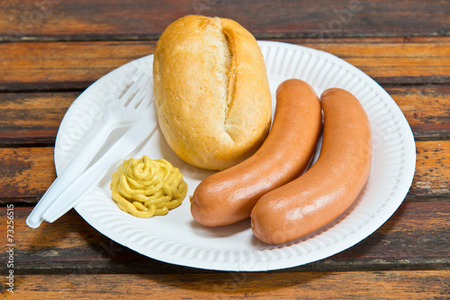 cooked sausage on paper plate