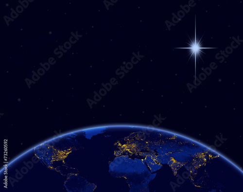 Fototapeta Naklejka Na Ścianę i Meble -  Planet earth and Christmas star in night sky