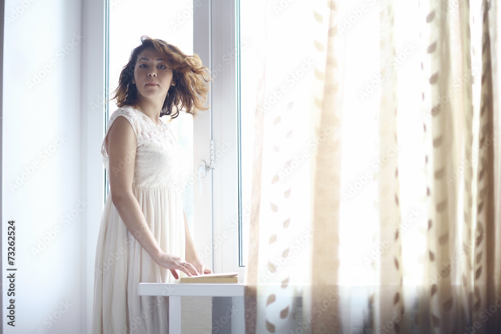 thoughtful girl at the window
