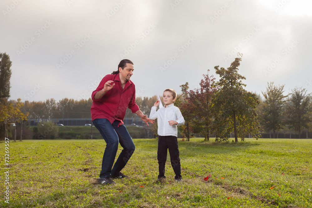 Dad and son playing