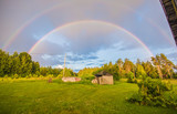 Double rainbow, summer field landscape