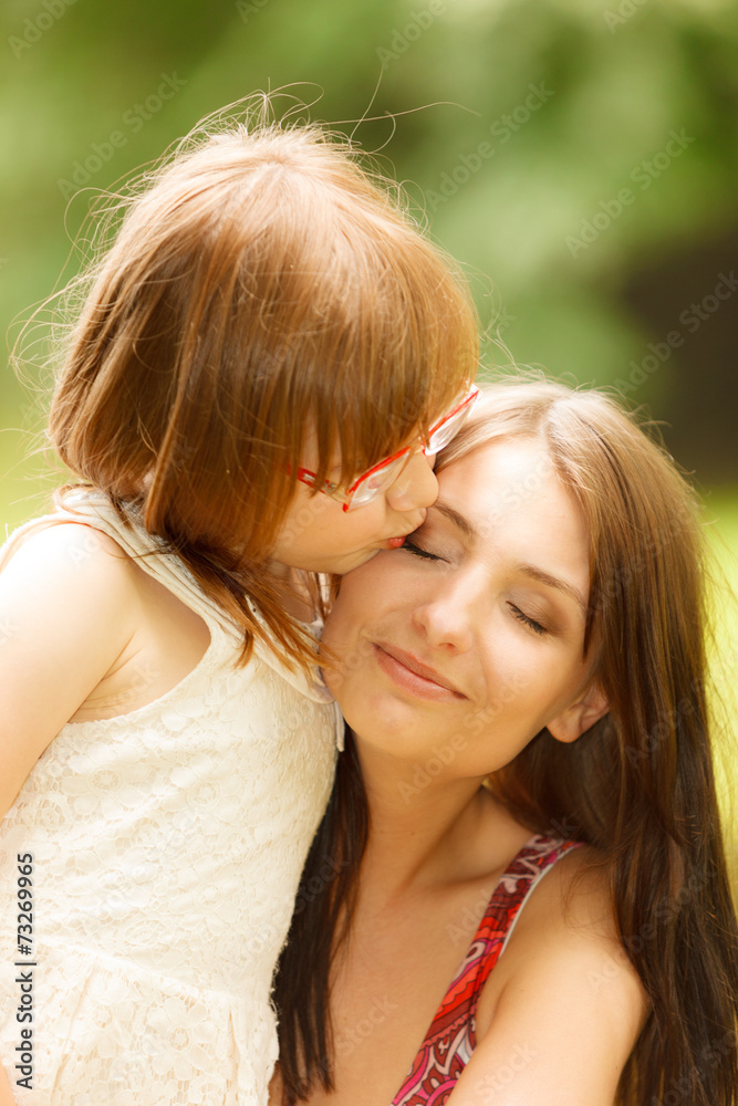 Little girl hugging his mother expressing tender feelings. Love. Little girl hugging his mother expressing tender feelings. Love.