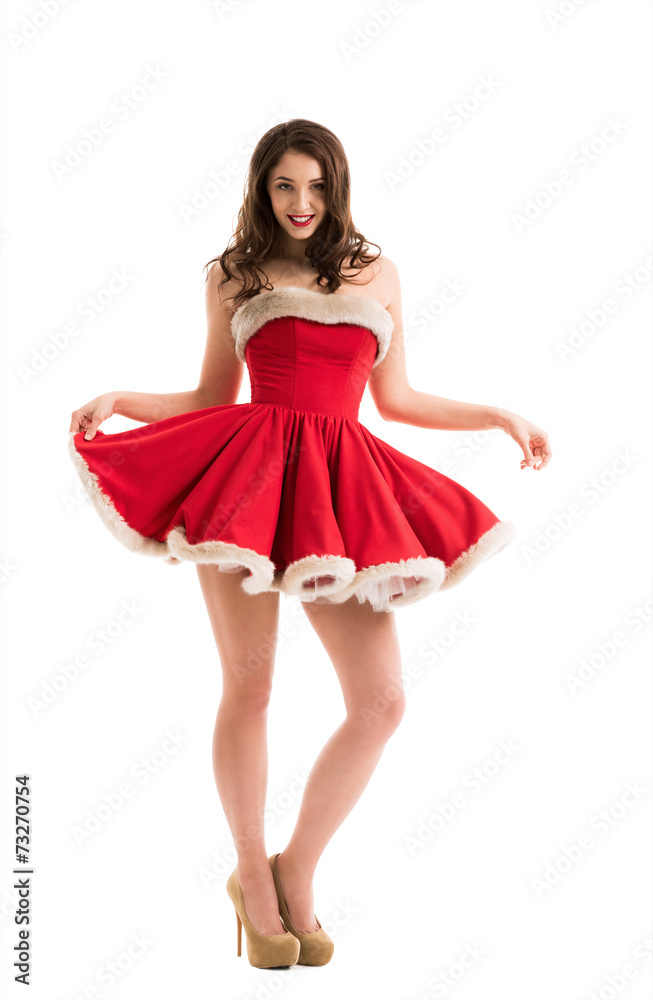 Beautiful happy woman in Santa Claus clothes