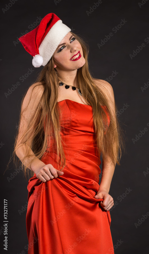 Girl in a Christmas cap and gown Girl in a Christmas cap and gown
