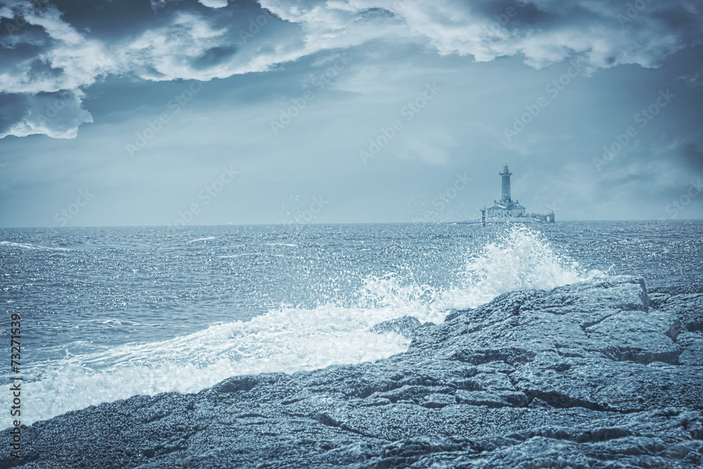 Lighthouse on a stormy day, artistic toned photo