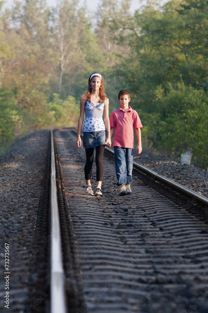Two children on rails