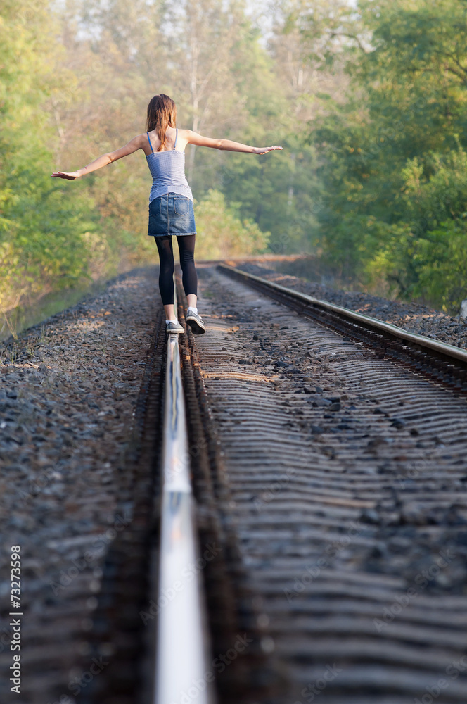Teen girl on rail