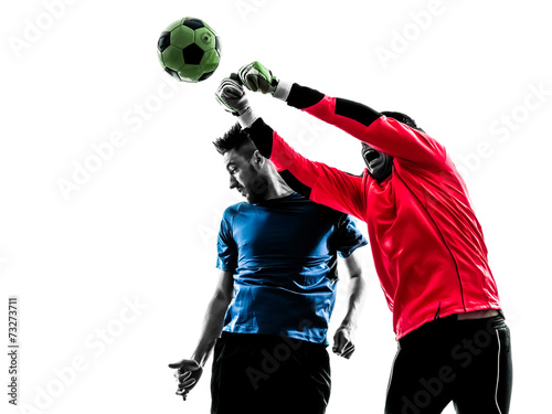 two men soccer player goalkeeper punching heading ball competiti photo