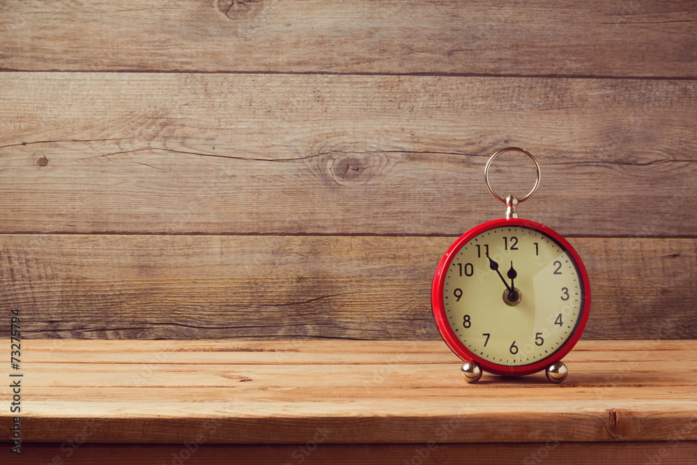 Clock on wooden table Clock on wooden table