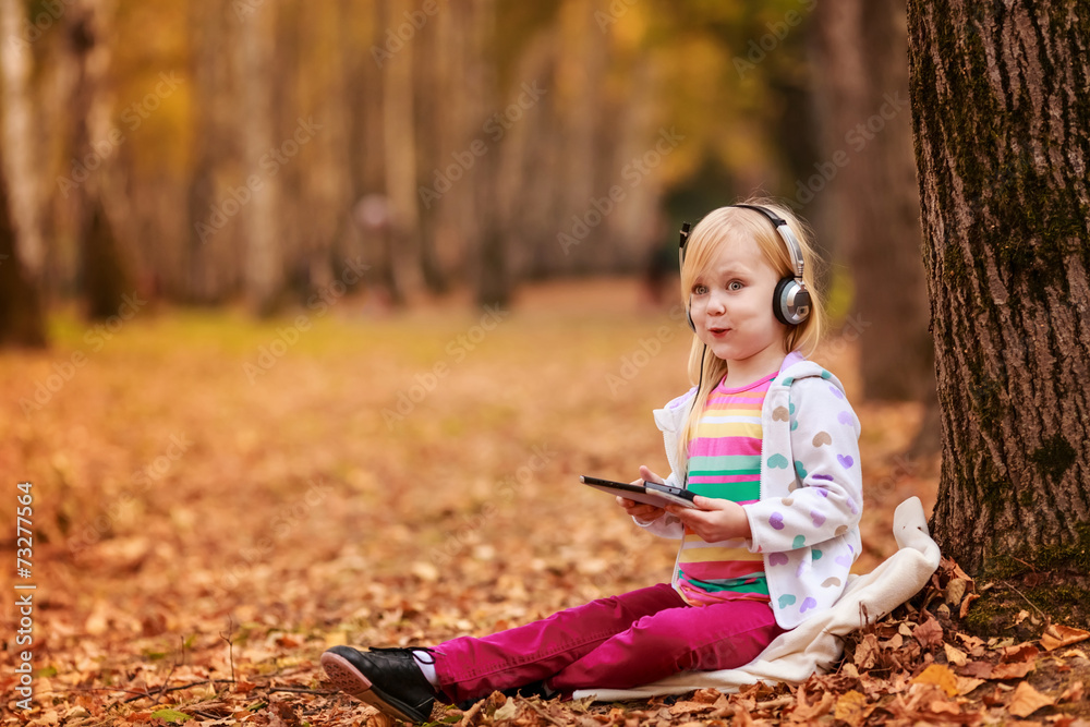 beautiful girl on nature with the tablet beautiful girl on nature with the tablet