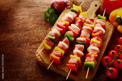 Fresh uncooked meat kebabs ready for grilling