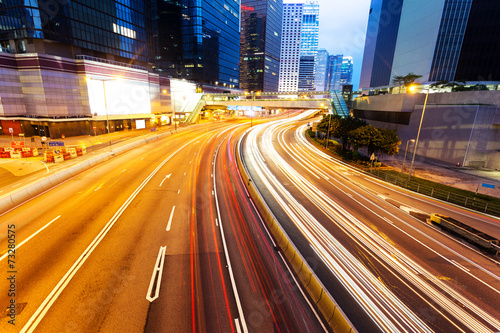 blur motion traffic lights of modern urban city at night