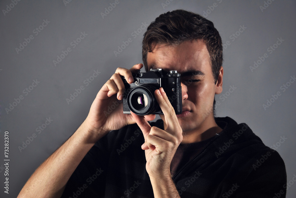 young photographer with analog camera young photographer with analog camera