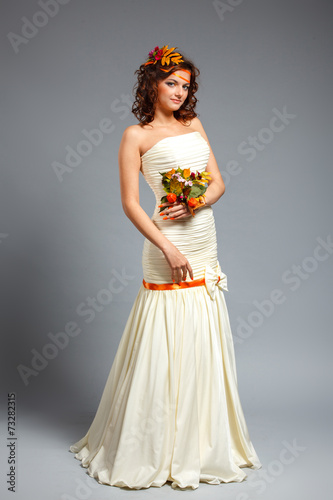 Happy bride with autumn bouquet